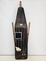 Full view of wooden ironing board featuring oil painting of barn and poultry scene