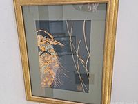 Full frontal view of framed goldleaf heron artwork