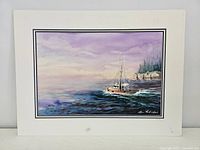 Full view of the watercolour painting with mat showing boat at sea and cliffs on horizon under pastel sky, signed by artist in lower right corner.