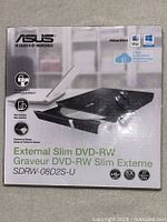 Front of ASUS External Slim DVD-RW Drive box showing model number and key features.