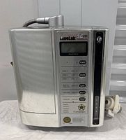 Front view of unit showing control panel, display, power button and model label