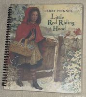 Cover page of the children's braille book titled 'Little Red Riding Hood' by Jerry Pinkney with illustrated image.