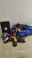 Photo showing duffel bag, gloves, Adidas pads, speed bag, and other boxing equipment