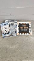 Image showing several of the paperback books fanned out, including Aikido book, SAS Urban Survival Handbook, and Off Grid magazine or sign behind them.