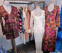 Rack and mannequins displaying all garments: mini dresses, maxi dresses, vest, jacket, and shirt