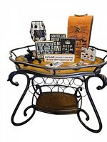 Full view of wine rack table with all lot items arranged on top, showing metal frame and wooden surfaces