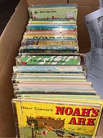 Box view from front showing many Little Golden Books including Walt Disney's Noah's Ark in front