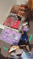 Overview of assorted Christmas ornaments, sewing supplies, and glass dish