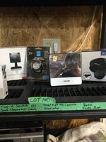 Shelving with the lot items and handwritten label describing contents