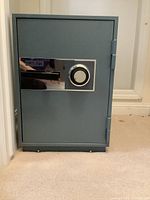 Front view of Meilink safe showing combination dial lock, handle, and brand label.
