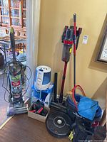 Overview of all items: Roomba, cordless vacuum, upright vacuum, humidifier, bucket and mop
