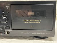 Front right side showing cassette door B with AUTO REVERSE and 2 motor transport mechanism.