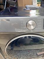 Front view of Samsung electric dryer control knob and cycle options showing Normal, Mixed Load, Heavy Duty, Sanitize, Towels, Perm Press, Delicates, Wool, 30' Express cycles.