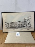 Framed architectural rendering artwork depicting a mid-century modern building with palm trees and landscaping. Illustration board measures 16 x 26 inches.