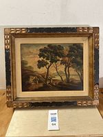Full frontal view of the framed oil painting depicting a landscape with trees and figures under a cloudy sky.