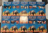 Photo showing 10 VHS cassette covers of Star Trek: The Animated Series, arranged in two rows of five. Covers are blue with colorful animated Star Trek artwork and episode titles visible.