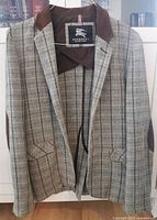 Full front and inside view of men's blazer jacket showing tweed pattern, brown suede collar, and Burberry Black Label logo inside.