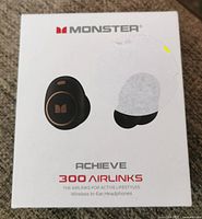 Front of the box showing product name, brand, and image of the earbuds.