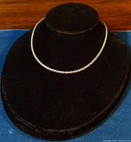 Choker style 925 sterling silver rope chain necklace displayed on a black velvet bust stand.