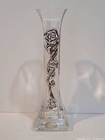 Front and side view of clear crystal vase with silver rose ornament on the side, showing details of the silver decoration and vase shape.