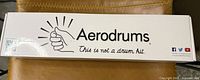 Top view of the closed Aerodrums box showing the brand logo and tagline 'This is not a drum kit'.