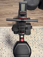 Front view showing handlebar, LCD monitor and footrests with straps