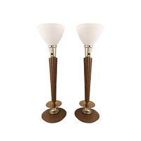 Pair of mid century modern table lamps showing full height and design with wooden tapered bodies, brass and metal bases, and white glass shades.
