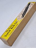 Original wooden box with yellow label for 'The Amazing Scotch Duck Call' from Scotch Game Call Co.