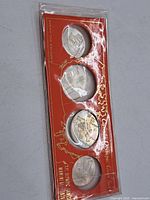 Full set of four coins in original red display card