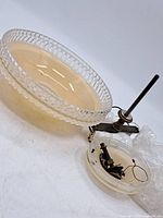 Glass ceiling fixture and metal mounting hardware with wires, showing condition and components included.