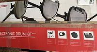 Photo of the unopened box showing the product image and branding for Ion electronic drum kit model IED01.