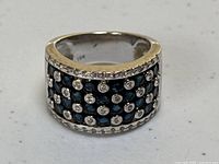 Front view showing checkerboard pattern of sapphires and diamonds