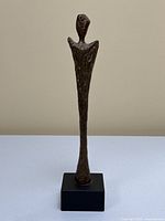 Full front view of the sculpture on base