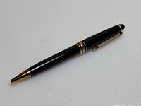 Pen angled view on light background showing full barrel, tip and cap