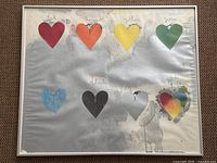 Frontal view of screen print showing eight colored hearts on silver background with frame