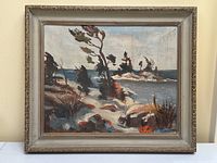 Overall view of framed painting showing composition of pine trees, rocks and lake.