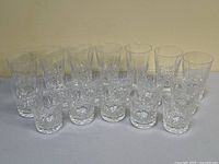 Front view of all 18 glasses arranged in two rows