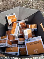 Box filled with multiple boxed bicycle inner tubes showing the Prestige brand and Schrader Valve specification.