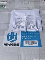 Top of the box showing HeatGene brand label, model HG-R6484B, measurements, and weight along with installation instruction sheet.