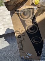 Box showing Polk Audio Monitor 60 Series II branding and speaker image.