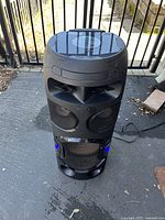 Full front view of the Sony party boombox showing speaker drivers, LED lights and power cable attached