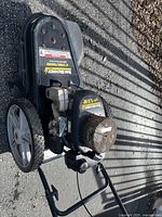 Top and side view showing the Yard Machines logo, 5.0 HP Tecumseh engine on the string trimmer, deck and wheels with wear and some rust.