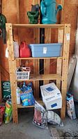 Photo of pine wood shelving unit in a garage, with various items around it showing shelf dimensions and construction.