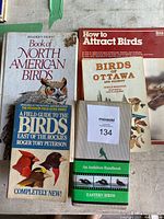 Six assorted bird books with covers featuring different bird illustrations, some with visible damage and staining.