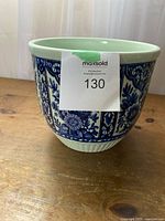 Front view of the Boch ceramic bowl showing the blue floral vertical panel design with a creamy white interior rim.