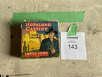Vintage Hopalong Cassidy film reel box featuring Prairie Vengeance labeling and western artwork.