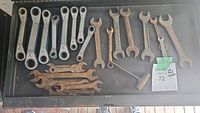 Tray with assortment of ratcheting and open-ended wrenches, mix of cleaned and rusted condition