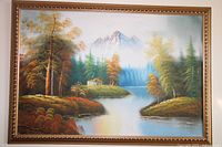 Full view of the oil painting showing a framed scenic landscape with river, trees, mountain and cabin.