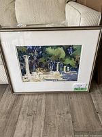 Full view of framed watercolor painting showing scene of columns and trees
