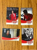 Four Sidney Crosby hockey cards laid out flat, front side visible, with Dempster's Bread branding and motivational captions.